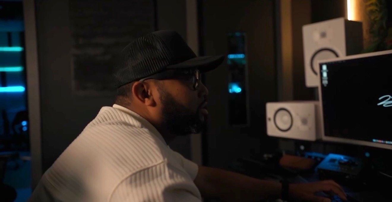 Music producer working at a recording studio workstation